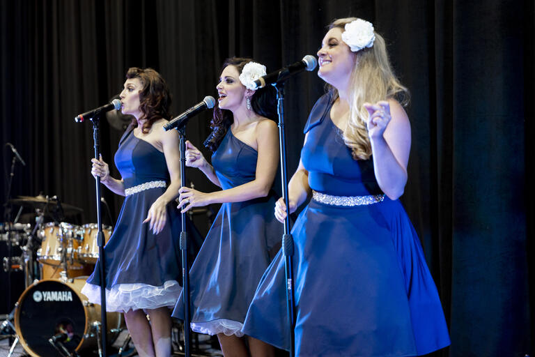 Women singing onstage