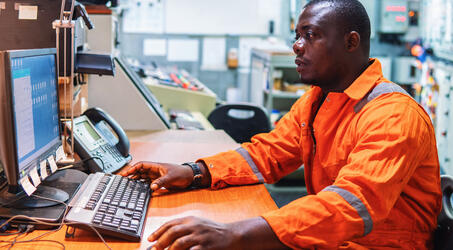 engineer looking at computer