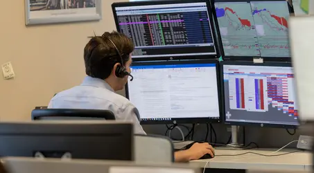 World Fuel Services Employee looking at data on screens