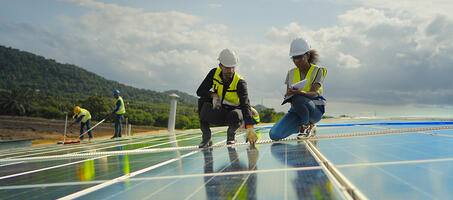 people on solar panel