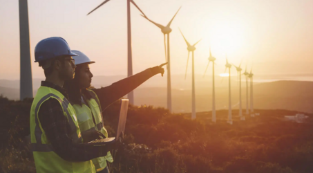 energy experts in front of wind turbines