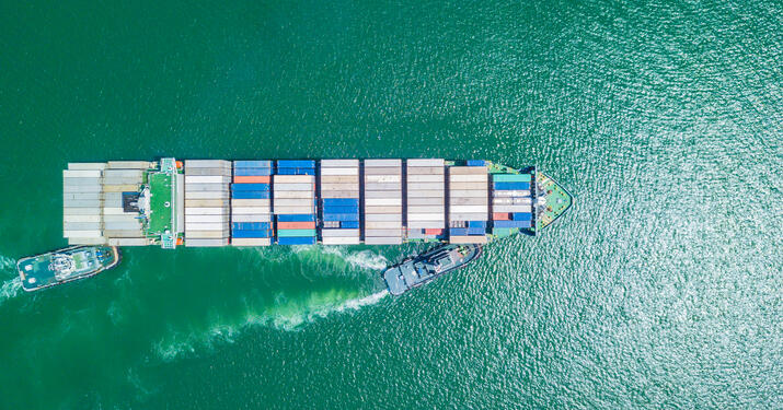 Vessel in Clear Water above view with taxi or fuel boat assistance